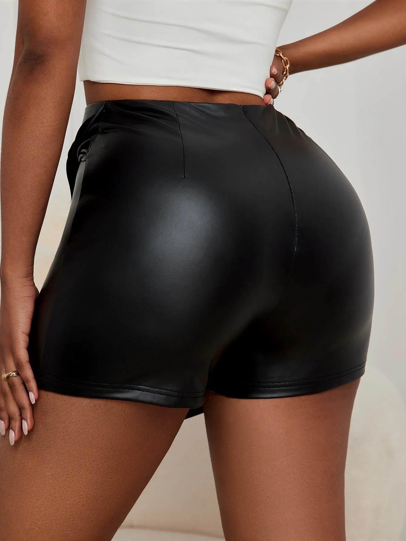 Edgy Asymmetrical Faux Leather Mini Skirt with Wrap Detail