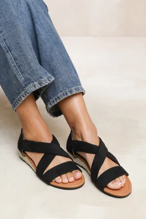 HUMMINGBIRD WIDE FIT LOW WEDGE SHOES WITH CROSS OVER STRAP IN BLACK SUEDE